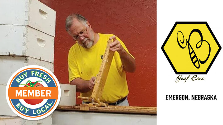 Graf Bees Member Spotlight photo showcasing Mark Graf scraping a hive for honey