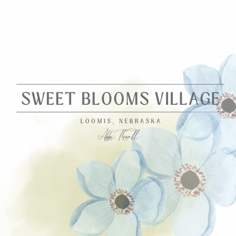 Sweet Blooms Village logo with blue watercolor flowers and soft pastel background.